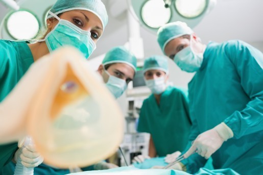 Anesthesia mask holding by a nurse in an operating theatre