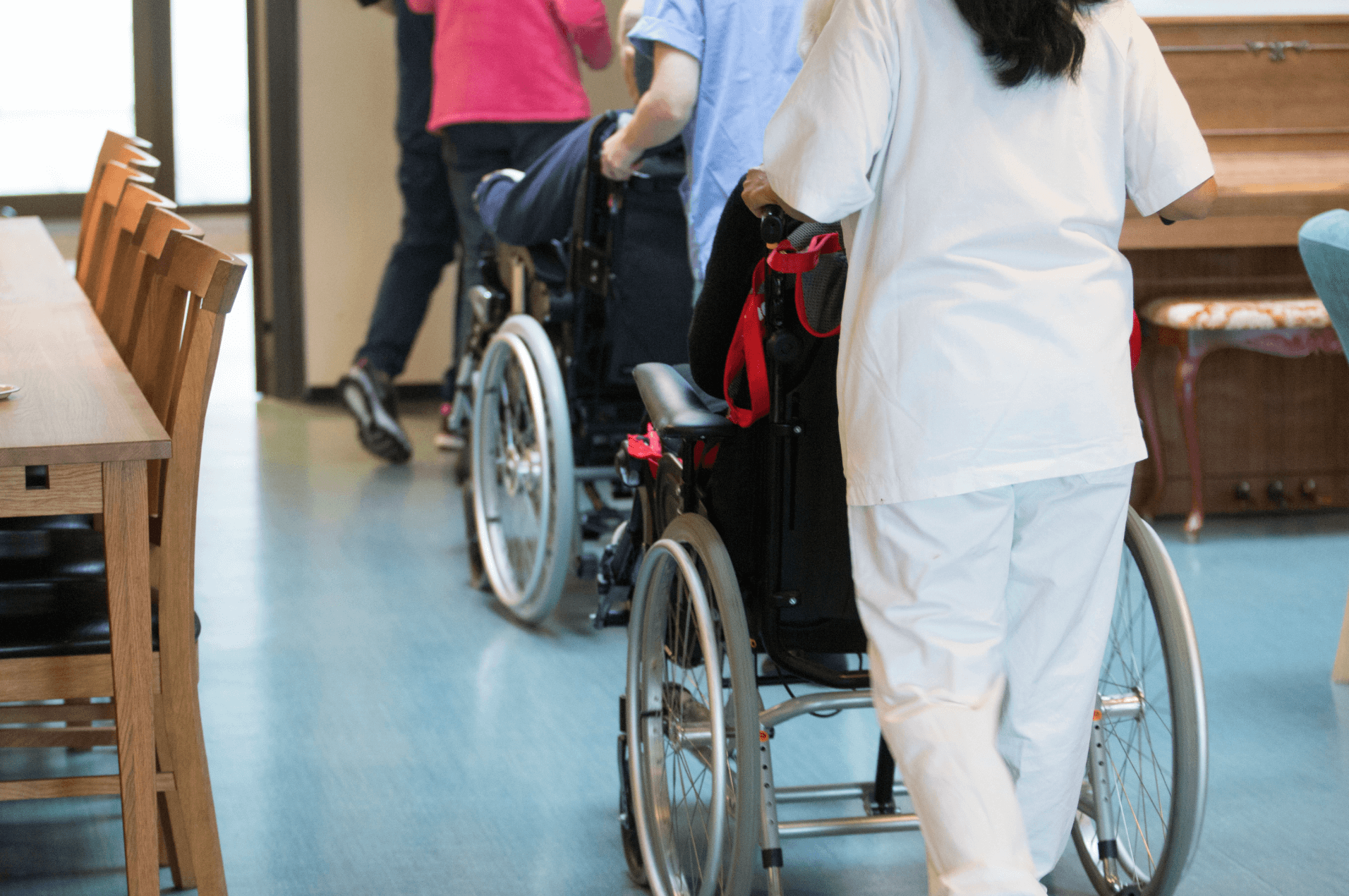 elderly people in a nursing home in wheelchairs